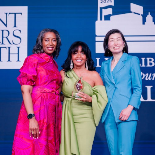 Gladys Vega, President and CEO of La Colaborativa in Massachusetts accepts the 2026 Andy Hyman Award for Advocacy.